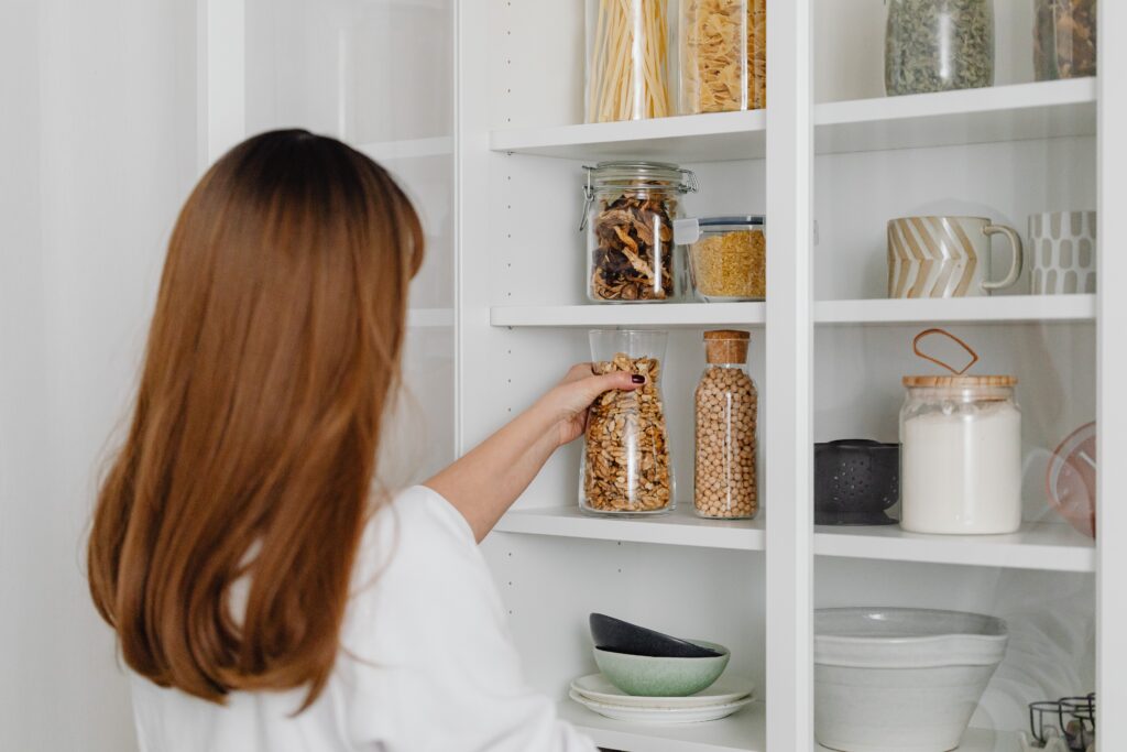 Woman decanting pantry items