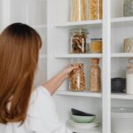 Woman decanting pantry items
