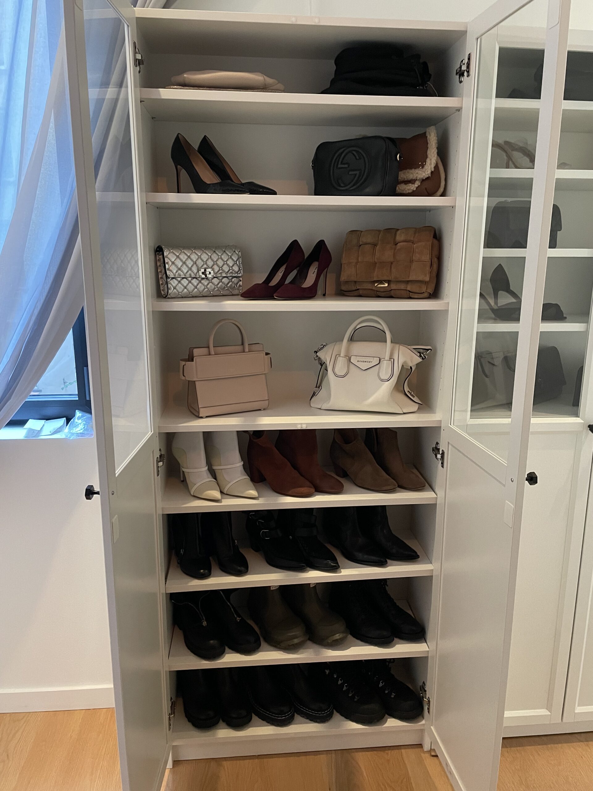 Styled shoes and bags in closet